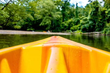 Image showing view from kayak towards mountain river rushing waters