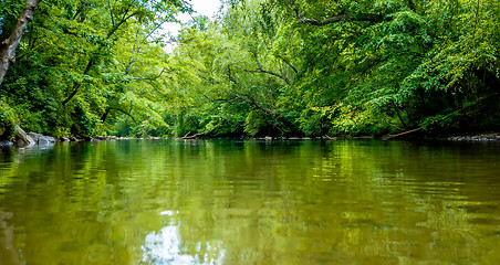 Image showing view from kayak towards mountain river rushing waters