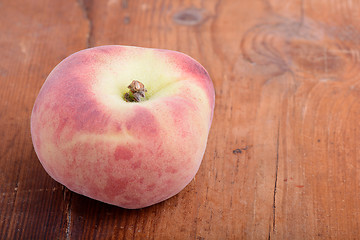 Image showing peach set on the wooden background