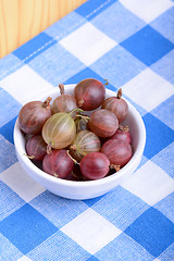 Image showing Green gooseberries on white plate