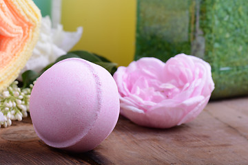 Image showing Spa theme with candles and flowers on wooden background