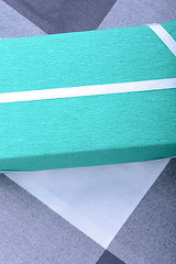Image showing Green gift box with white ribbon