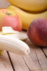 Image showing fruits on table, apple, bananas, peach close up, health food concept