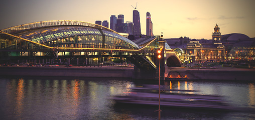 Image showing Night cityscape Moscow city with bridge, river and motion boat