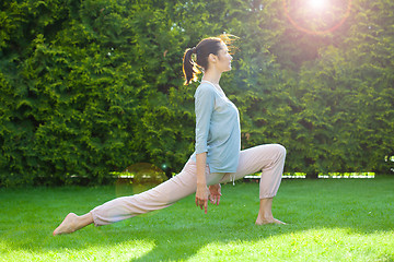 Image showing pretty adult woman doing yoga