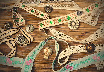 Image showing vintage buttons, lace, tape and ribbons