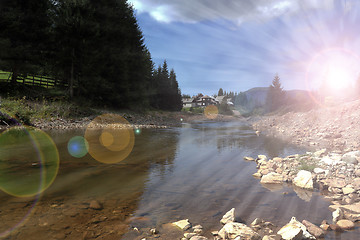 Image showing sun rays over mountain river