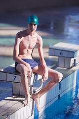 Image showing swimmer excercise on indoor swimming poo