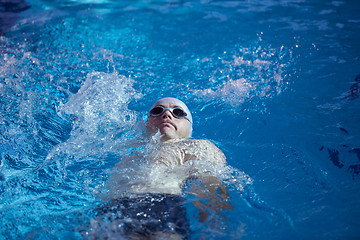 Image showing swimmer excercise on indoor swimming poo