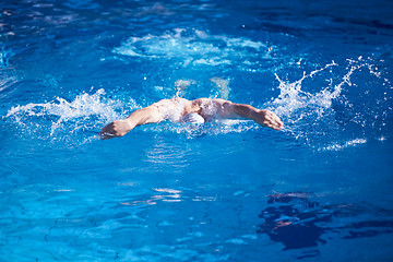 Image showing swimmer excercise on indoor swimming poo