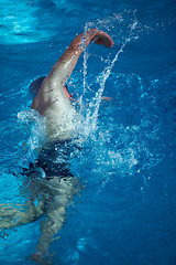 Image showing swimmer excercise on indoor swimming poo