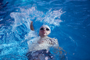 Image showing swimmer excercise on indoor swimming poo