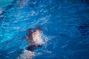 Image showing swimmer excercise on indoor swimming poo