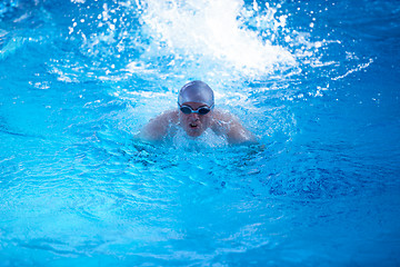 Image showing swimmer excercise on indoor swimming poo