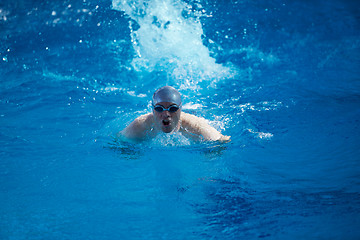 Image showing swimmer excercise on indoor swimming poo