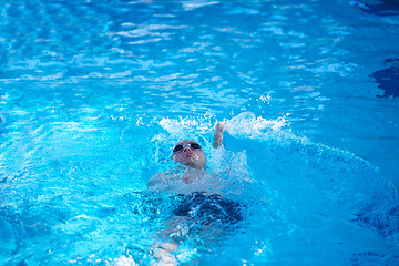 Image showing swimmer excercise on indoor swimming poo