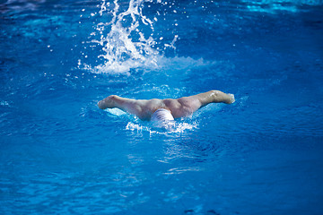 Image showing swimmer excercise on indoor swimming poo