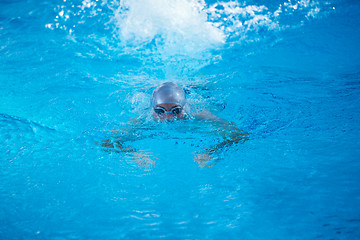 Image showing swimmer excercise on indoor swimming poo