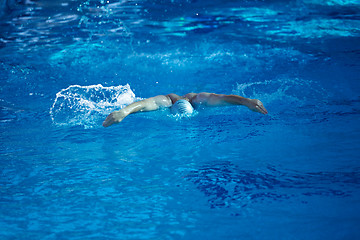 Image showing swimmer excercise on indoor swimming poo