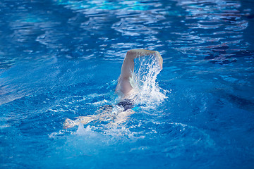 Image showing swimmer excercise on indoor swimming poo