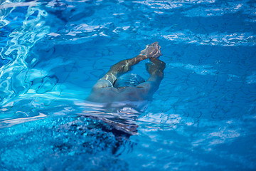 Image showing swimmer excercise on indoor swimming poo