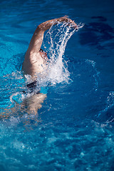 Image showing swimmer excercise on indoor swimming poo