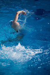 Image showing swimmer excercise on indoor swimming poo