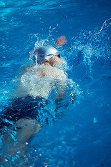 Image showing swimmer excercise on indoor swimming poo