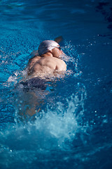 Image showing swimmer excercise on indoor swimming poo