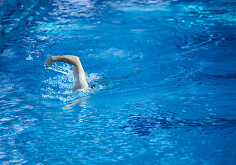 Image showing swimmer excercise on indoor swimming poo