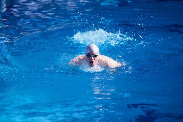 Image showing swimmer excercise on indoor swimming poo