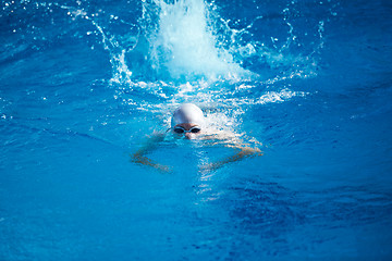 Image showing swimmer excercise on indoor swimming poo