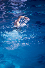 Image showing swimmer excercise on indoor swimming poo