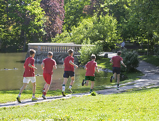 Image showing Young boys run in park