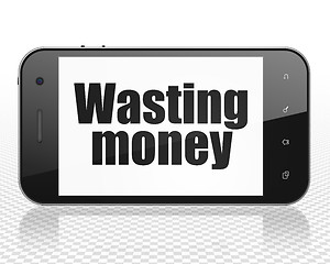 Image showing Money concept: Smartphone with Wasting Money on display