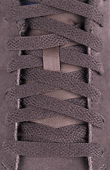 Image showing close-up laces on the brown boots