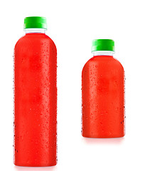 Image showing bottles fruit juice with drops of water isolated