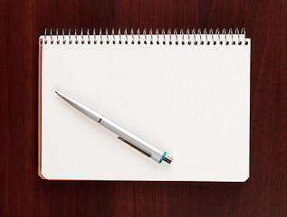 Image showing pen and blank paper on wood