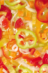 Image showing Red, yellow and green bell pepper slices