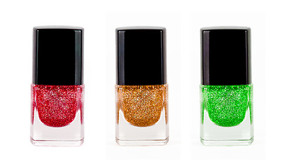 Image showing Red, yellow, green nail polisher