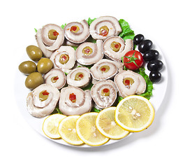 Image showing fish slices served with tomato and olives