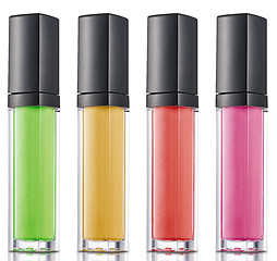 Image showing Colorful nailpolish in a row isolated over white