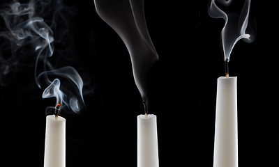 Image showing extinguished candle with smoke