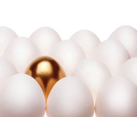 Image showing one gold egg lays among common white eggs