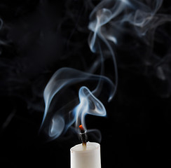 Image showing Extinguished candle with smoke