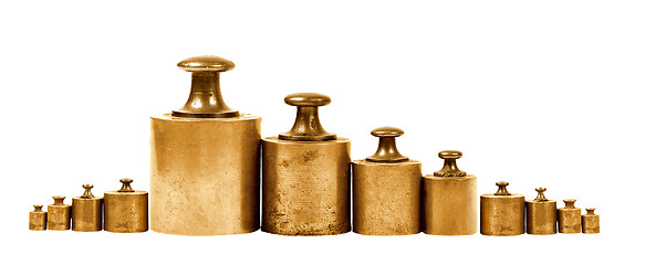 Image showing set of precision weights for a balance scale