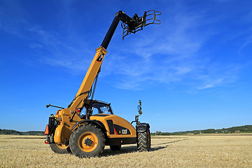 Image showing Cat TH407C Telescopic Handler on Stubble Field