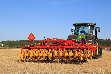 Image showing Vaderstad Opus 400 Cultivator and John Deere Tractor on Field