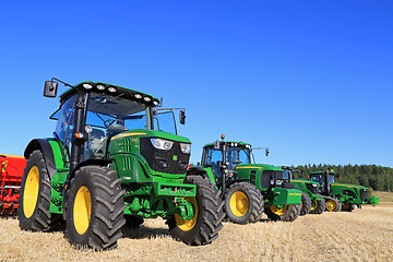 Image showing Line up of John Deere Agricultural Tractors