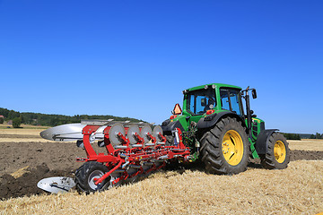 Image showing John Deere 6630 Tractor and Agrolux Plow Plowing the Field 